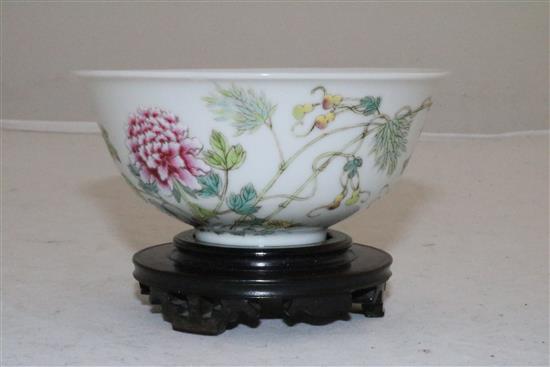 A Chinese famille rose bowl, diameter 10.8cm, wood stand